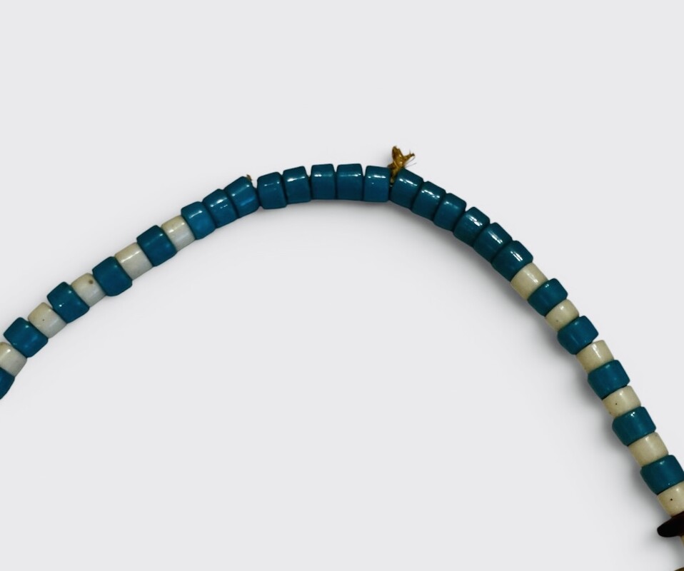 M 556 AG glass necklace and bear claw, early 20th century 