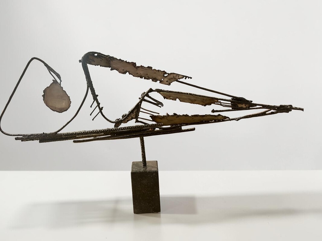 M 559 FL brutalist metal sculpture on blue stone socle 