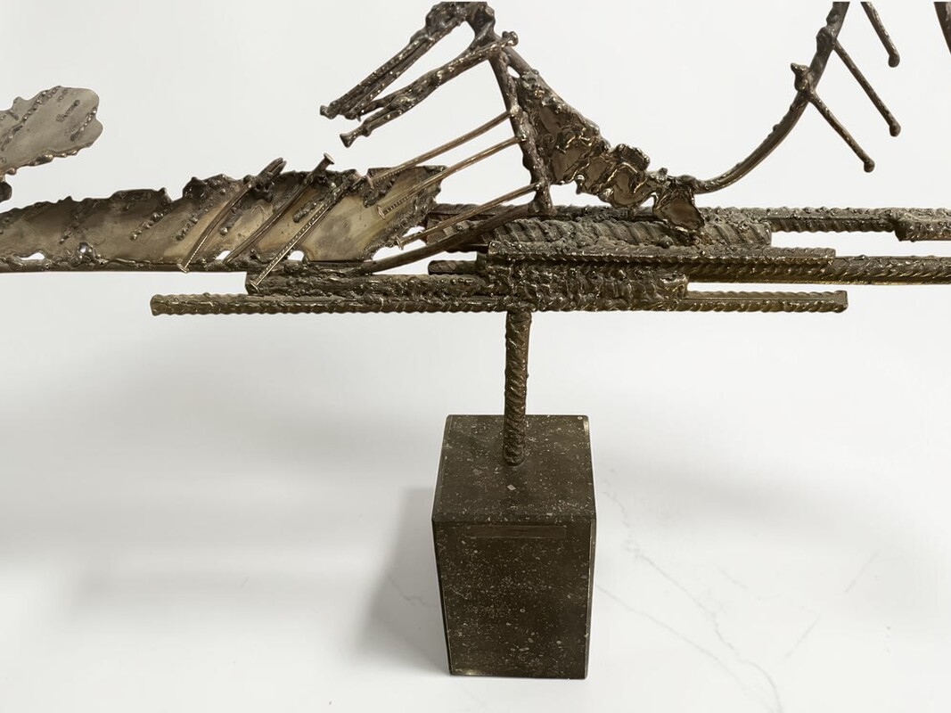 M 559 FL brutalist metal sculpture on blue stone socle 