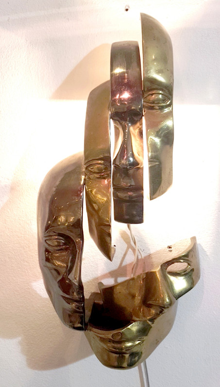 M 74 AV Lighted wall sculpture in the manner of Arman. Bronze with two patinas. Ca. 1980